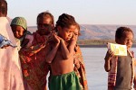 Kids show interest in our campsite on the banks of the Tsiribihina river, Madagascar. : Madagascar