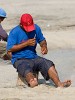 Meticulously  repairing fishingnets on Santa Clara's beach. : Panama, People