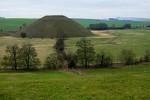 Silbury hill: the largest man-made mound in Europe. The mysterious hill compares in height and volume to the roughly contemporary Egyptian pyramids. It was probably completed around 2400 BC. Though clearly important in itself, its purpose and significance remain unknown. : United Kingdom