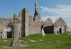 Cross of the Scriptures (replica) and west front of the Clonmacnoise Cathedral, Ireland. : Ireland