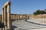 Columns around the unusual oval-shaped Forum. The Forum or plaza, in the heart of the city, links the main thouroughfare (Cardo Maximus) with the Temple of Zeus. It served as a market place and was the centre of the city's political and social life. : Jordan