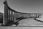 Columns around the unusual oval-shaped Forum. The Forum or plaza, in the heart of the city, links the main thouroughfare (Cardo Maximus) with the Temple of Zeus. It served as a market place and was the centre of the city's political and social life. : Jordan