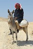 Bedouin posing before riding off into the desert. : Jordan