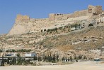 Karak Castle  Karak (or Kerak) Castle is a large crusader castle located in Karak, Jordan. Karak has been inhabited since at least the Iron Age, and was an important city for the Moabites. Construction of the Castle began in the 1140s under Pagan or Paganus. It is one of the largest crusader castles in the region. The Crusaders called it Crac des Moabites or "Karak in Moab". It is probably the most famous Castle in the long chain of Castles built by the Crusaders, ranging from Aqaba in the South to Turkey in the North. The castle was only in Crusader hands for 46 years. It had been threatened by Saladin's armies several times but finally, surrendered in 1183, after a epic siege that lasted more than a year. The motion picture  Kingdom of Heaven  contains a fictional portrayal of the siege. : Jordan