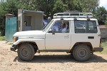 One of Attat's many tiny sisters in her enormous all-terrain vehicle.