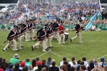 The "Twilight Tattoo" in Arlington, VA. This hour-long public performance features Soldiers from The 3rd U.S. Infantry Regiment (The Old Guard) and The U.S. Army Band "Pershing's Own". They offer a glimpse into American history through performances by The U.S. Army Blues, vocalists from The U.S. Army Band Downrange, The Old Guard Fife and Drum Corps, and The U.S. Army Drill Team.  The history of Twilight Tattoo began more than 300 years ago as British troops were summoned from the warmth and hospitality of local pubs by a bugle and drum call to return to the barracks. The familiar tune told tavern owners “doe den tap toe,” or “time to turn off the taps.” The troops knew the call to mean “taps off,” and minutes later they were back in their tents.