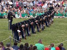 The "Twilight Tattoo" in Arlington, VA. This hour-long public performance features Soldiers from The 3rd U.S. Infantry Regiment (The Old Guard) and The U.S. Army Band "Pershing's Own". They offer a glimpse into American history through performances by The U.S. Army Blues, vocalists from The U.S. Army Band Downrange, The Old Guard Fife and Drum Corps, and The U.S. Army Drill Team.  The history of Twilight Tattoo began more than 300 years ago as British troops were summoned from the warmth and hospitality of local pubs by a bugle and drum call to return to the barracks. The familiar tune told tavern owners “doe den tap toe,” or “time to turn off the taps.” The troops knew the call to mean “taps off,” and minutes later they were back in their tents.