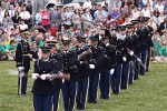 The "Twilight Tattoo" in Arlington, VA. This hour-long public performance features Soldiers from The 3rd U.S. Infantry Regiment (The Old Guard) and The U.S. Army Band "Pershing's Own". They offer a glimpse into American history through performances by The U.S. Army Blues, vocalists from The U.S. Army Band Downrange, The Old Guard Fife and Drum Corps, and The U.S. Army Drill Team.  The history of Twilight Tattoo began more than 300 years ago as British troops were summoned from the warmth and hospitality of local pubs by a bugle and drum call to return to the barracks. The familiar tune told tavern owners “doe den tap toe,” or “time to turn off the taps.” The troops knew the call to mean “taps off,” and minutes later they were back in their tents.