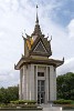 Choeung Ek - Phnom Penh, Cambodia. Choeung Ek, the site of a former orchard and Chinese graveyard about 17km south of Phnom Penh, is the best-known of the sites known as The Killing Fields, where the Khmer Rouge regime executed about 17,000 people between 1975 and 1979. Mass graves containing 8,895 bodies were discovered at Choeung Ek after the fall of the Khmer Rouge regime. Many of the dead were former inmates in the Tuol Sleng prison. Today, Choeung Ek is a memorial, marked by this Buddhist stupa. The stupa has acrylic glass sides and is filled with more than 5,000 human skulls. Some of the lower levels are opened during the day so that the skulls can be seen directly. Many skulls have been shattered or smashed in. : Cambodia