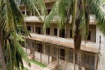 Tuol Sleng or S-21 prison - Phnom Penh, Cambodia. Formerly the Chao Ponhea Yat High School, named after a Royal ancestor of King Norodom Sihanouk, the five buildings of the complex were converted in 1975 into a prison and interrogation centre. The Khmer Rouge renamed the complex "Security Prison 21" (S-21) and construction began to adapt the prison to the inmates: the buildings were enclosed in electrified barbed wire, the classrooms converted into tiny prison and torture chambers, and all windows were covered with iron bars and barbed wire to prevent escapes. : Cambodia