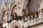 The Horses of St Mark - Venice, Iatly. The Horses of St Mark were installed on the basilica di San Marco about 1254. They date to Classical Antiquity; by some accounts they once adorned a Roman triumphal arch. The horses were found in Constantinople and in 1204 doge Enrico Dandolo sent them back to Venice as part of the loot sacked during the Fourth Crusade. They were taken by Napoleon in 1797 as war trophies and crowned the Arc de Triumphe in Paris. They were returned in 1815 and remained in place until the 1990s. Nowadays the horses are on display in an exhibition room in the basilica and the horses on the facade are bronze replicas. : Italy