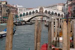 Ponte di Rialto (Rialto Bridge) - Venice, Italy. The first bridge across the Grand Canal, nothing more than a dodgy pontoon arrangement, was build here around 1180. A more permanent wooden structure was built in 1265, but was badly damaged during a rebellion in 1310. The bridge was repaired, but it collapsed in 1444 under the weight of a crowd watching the wedding procession of the Marquis of Ferrara. It was again rebuilt as a wooden drawbridge but finally it was replaced by the current marble bridge built by Antonio da Ponte. It was first commisioned in 1588 and finally completed in 1592. : Italy