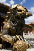 Bronze lion guarding the inner palace of the forbidden city. Following tradition, the male lion guards the right side of the doorway, standing on a ball to symbolize the unity of heaven and earth, while the female lion stands on a cub to represent the cycle of life. : China