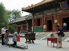 Incense burning and praying at the Yonghe temple. : China