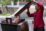 Burning large amounts of incense at the Lama temple in Beijing. : China, People