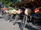 Neatly aligned tricycle taxis. : China