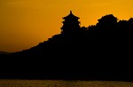 The Buddhist Fragrance Pavillion and the Temple of the Sea of Wisdom on the shore of Kunming lake. : China, Sunset