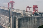 The Three Gorges Dam. To get a sense of the enormous size of this dam, take a look at the car and the people in the foreground. : China