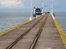 The small ferry to Altagracia (Isla de Ometepe), San Miguelito and San Carlos awaits at the end of Granada's long pier. : Nicaragua