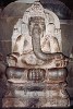 The Ganesha statue at Prambanan - Central Java, Indonesia. Its trunk is polished by the many visitors because it is said that touching the trunk, then your forehead, will increase your creativity. The right hand holding its broken tooth was destroyed during an earthquake.