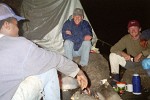 Warming-up by the campfire - Kilimanjaro, Tanzania.