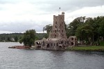 Alster Tower on Heart Island (NY) Alster Tower, the Boldt's playhouse, was the first structure Boldt erected on Heart Island. Its design suggests a defense tower similar to those on the Alster River in Germany. But this curious mini-castle probably was not pre-designed, since it would have been nearly impossible to describe its eccentric and irregular forms on paper. It was likely improvised by Boldt himself in a highly personal manner, and evolving as it rose. This building was intended for the entertainment of guests and the Boldt children. The ornate "Shell Room" was to be used for dancing, and was so named because of the shape of the roof. The basement housed a bowling alley, and the upper floors were to include a billiard room, library, bedrooms, cafe, grill and kitchen. Unlike the main residence, which was never completed, this whimsical "play house" was completed and occupied by the Boldt family during the four years when the Castle was being erected. After extensive renovations to repair the deterioration of the edifice, Alster Tower is now open to visitors.