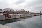 The Fortress of Louisbourg National Historic Park - Nova Scotia, Canada. Fortress Louisbourg was built to protect France's interests in the new world and to serve as the centre of its massive seasonal fishing industry.Its location near the eastern tip of Cape Breton Island, Nova Scotia enabled it to serve not only as the capital of the new colony of Ile Royale but also to act as the first line of defence for France in its 18th century struggle against Great Britain for colonial supremacy in North America. Fortress Louisbourg was first captured in 1745 after a six week siege by New England troops with the support of the British navy. After three years under British governors, the Fortress of Louisbourg was returned to France by treaty in 1749 inspite of the protests of the American colonies. After almost a decade of increasing prosperity, the much stronger Fortress again fell again after another six week siege in 1758, this time to the largest assembled assault force in colonial Canadian history.The fortifications were blown up in 1760-61 and the British military presence withdrawn in 1768. The imported cut stone which was widely used in the original construction of the Fortress was re-used around the province, and is still found in buildings standing today at both Halifax and Sydney, Nova Scotia and along the eastern seaboard. The new town of Louisburg would be a community established first by English and Irish soldiers who served at the second siege of Louisbourg and at Quebec, to be joined soon afterwards by Loyalists and more Irish via Placentia, Nfld.