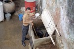 Cleaning the pigs in trinidad, Cuba.