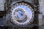 The medieval Prague Astronomical Clock or Prague Orloj (Czech: Pražský orloj) The Orloj is mounted on the southern wall of Old Town City Hall in the Old Town Square. The Orloj is composed of three main components: the astronomical dial, representing the position of the Sun and Moon in the sky and displaying various astronomical details; "The Walk of the Apostles", a clockwork hourly showing figures of the Apostles and other moving sculptures; and a calendar dial with medallions representing the months. The oldest part of the Orloj, the mechanical clock and astronomical dial, dates back to 1410 when it was made by clockmaker Mikuláš of Kadan and Jan Šindel. Later, presumably around 1490, the calendar dial was added and clock facade decorated with gothic sculptures. In the 17th century moving statues were added, and figures of the Apostles were added after major repair in 1865-1866. There exists a good deal of misinformation relating to the construction of the Orloj. For a long time it was believed that the Orloj was constructed in 1490 by clockmaster Jan Ruže (also called Hanuš) and his assistant Jakub Cech. Another fictitious story involves the clockmaker Hanuš being blinded on the order of the Prague Councillors to prevent him from constructing another similar clock.