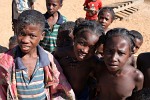 A warm welcome by some very curious kids on the banks of the Tsiribihina river, Madagascar. : Madagascar