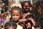 A warm welcome by some very curious kids on the banks of the Tsiribihina river, Madagascar. : Madagascar