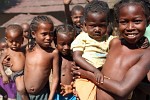 A warm welcome by some very curious kids on the banks of the Tsiribihina river, Madagascar. : Madagascar